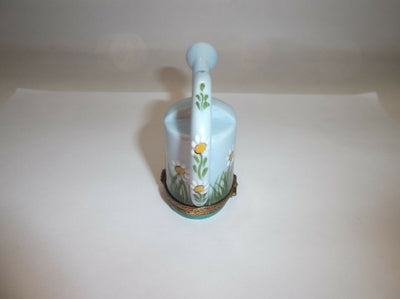 A charming watering can with delightful daisy motif