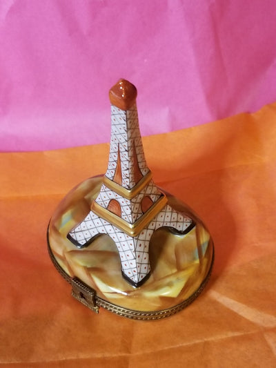 Elegant and intricate white Eiffel Tower figurine with brown stand