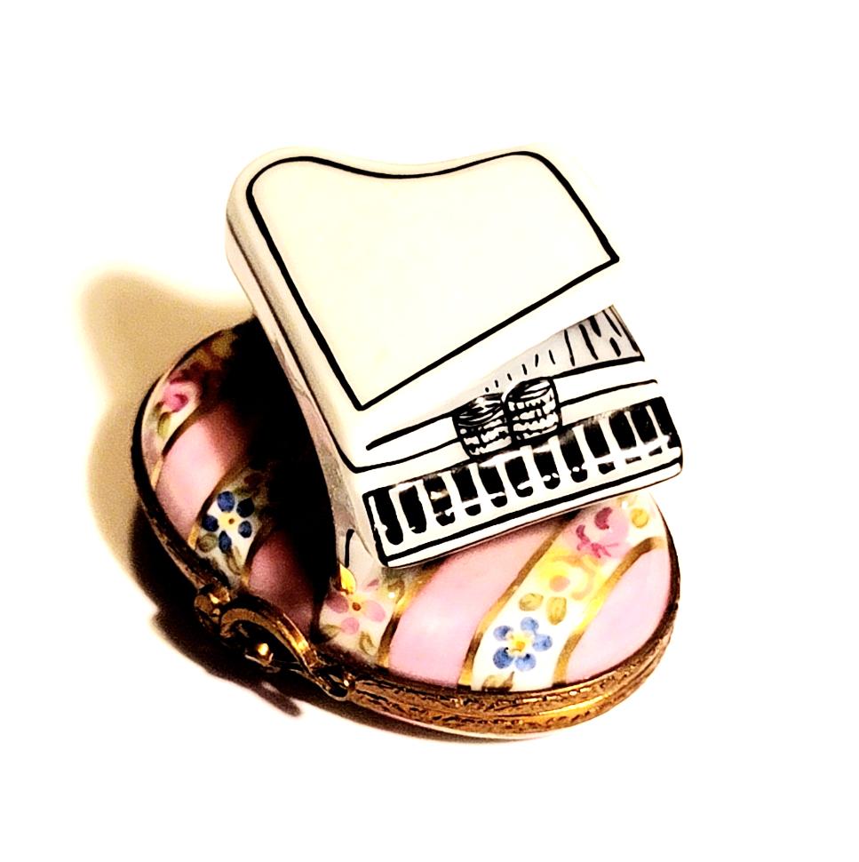 Beautiful white piano with elegant design and polished finish, set on a soft pink background