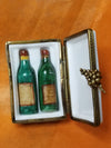 Antique wine crate containing two aged and collectible wine bottles