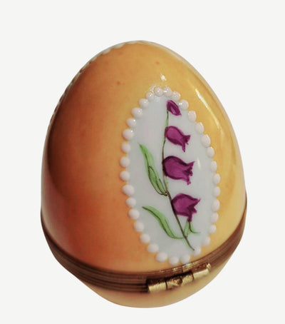 Beautifully detailed yellow Easter egg featuring stunning roses and floral decorations