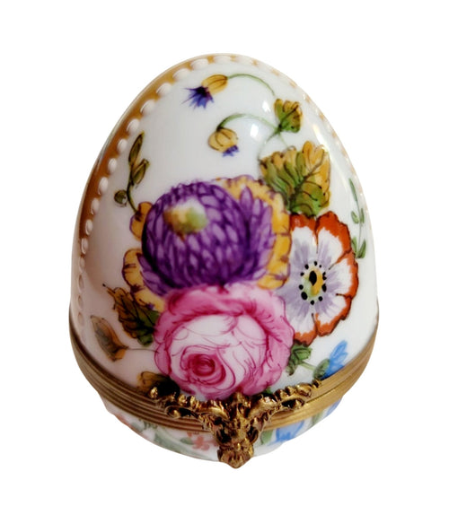 Yellow Easter egg adorned with vibrant roses and delicate flower designs 