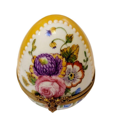 Elegant yellow Easter egg adorned with handcrafted roses and intricate flower designs
